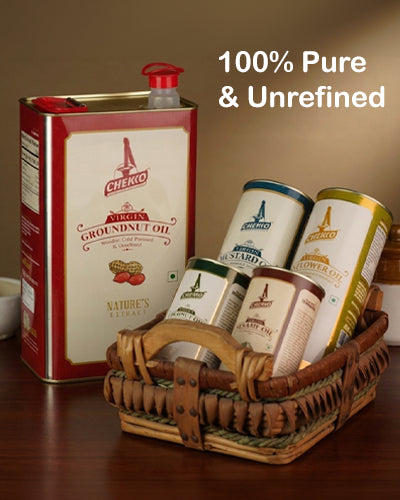 Chekko cold pressed oil tin in a wooden basket